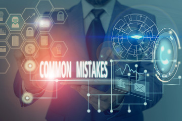 Writing note showing Common Mistakes. Business concept for actions that are often used interchangeably with error Picture photo network scheme with modern smart device