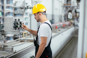 Fototapeta premium Portrait of man working in factory 