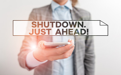Handwriting text Shutdown Just Ahead. Conceptual photo closing factory business either short time or forever Business concept with mobile phone and business woman