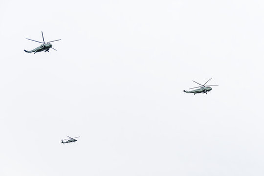 Washington DC, USA - March 17, 2017: Three presidential helicopters flying isolated against cloudy sky by national mall