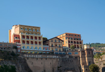 Fototapeta na wymiar View of houses and hotels on the cliffs in Sorrento. Gulf of Naples, Campania, Italy