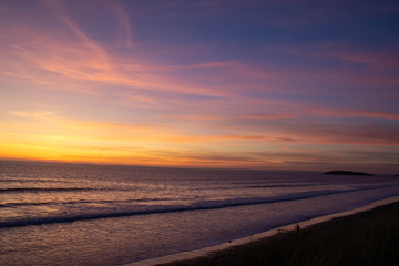 Fototapeta na wymiar Sunset on the beach with beautiful colours 