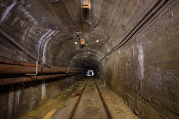 Gold iron mine ore shaft tunnel drift with rails underground