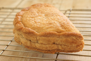 Traditional English Cornish pasty filled with meat and potatoes