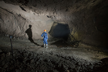 Gold iron mine ore shaft tunnel drift with miner