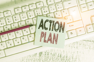 Writing note showing Action Plan. Business concept for detailed plan outlining actions needed to reach goals or vision Keyboard office supplies rectangle shape paper reminder wood