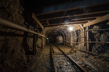 Fototapeta na wymiar Gold iron mine ore shaft tunnel drift with scoop ramp scraper slide