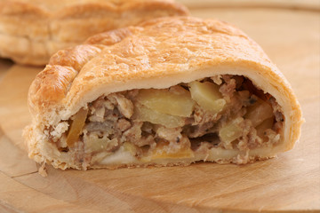 Traditional English Cornish pasty filled with meat potatoes and swede
