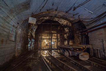 Fototapeta na wymiar Gold iron mine ore shaft tunnel drift with rails underground infrastructure