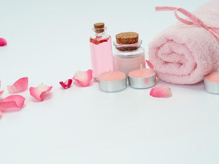 Fototapeta na wymiar Spa set of rose oil and scented candles