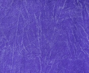 Purple violet color acid jeans denim abstract pattern old retro vintage textile linen cotton surface backdrop background with scuffed paint
