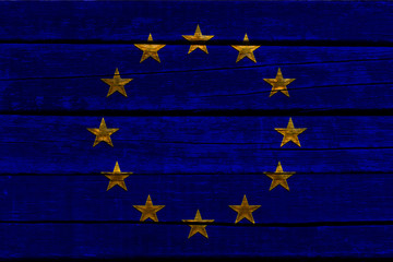 close-up photo of beautiful colored stylized European Union flag, symbol of united Europe on textured fabric, concept of tourism, emigration, economy and politics, close-up