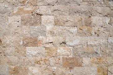  beige natural stone wall for background