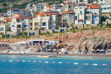 Shore and beach of a seaside town, view from the sea