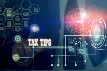 Fototapeta na wymiar Conceptual hand writing showing Tax Tips. Concept meaning compulsory contribution to state revenue levied by government Picture photo network scheme with modern smart device