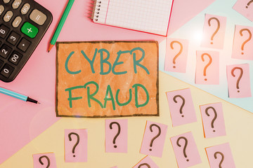 Writing note showing Cyber Fraud. Business concept for any crime that is committed with the use of a computer Mathematics stuff and writing equipment above pastel colours background