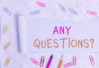 Conceptual hand writing showing Any Questions Question. Concept meaning you say write order to ask demonstrating about something Stationary and torn cardboard on a plain pastel table backdrop