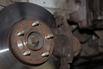 brake discs and brake pads, disassembled wheel of a car