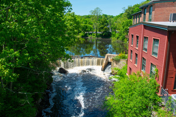 Sandford Mill on Charles River in Medway historic town center in summer, Medway, Boston Metro West...
