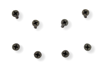 Drywall and black screws from different angles on a white background. The screw is screwed into the drywall. Black screws isolated on white. Fixing screws for construction on a white background.