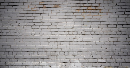 Rough aged masonry background. Backdrop of old white bricks with shabby texture