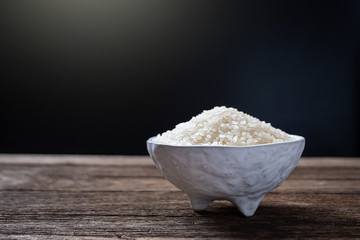 Japanese rice in a cup on the wooden floor. Close up shot.