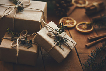 Three Christmas gifts on wooden boards with decoration