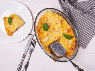 Frittata with pumpkin. on a white wooden table.