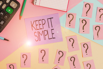 Conceptual hand writing showing Keep It Simple. Concept meaning to make something easy to understand and not in fancy way Mathematics stuff and writing equipment on pastel background