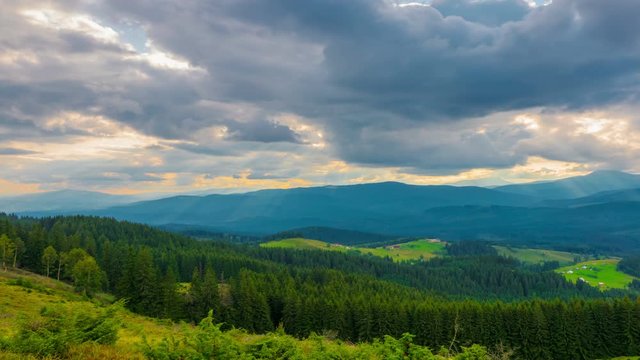 The Mountain Forest on Background of Sunset with Sun Rays. Dramatic Sunset Sky. Timelapse. 4K.