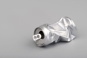 Crumpled empty blank soda or beer can garbage. Crushed junk can recycle