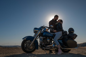 Fototapeta na wymiar Couple in love and motorcycle