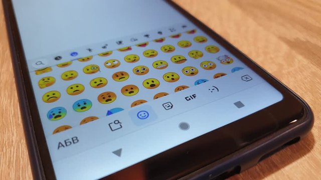 Choose emoticons on your smartphone. Emoticons chatting.