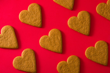 Heart shaped cookies pattern isolated on red background. Valentine's Day and Mother's Day concept.	