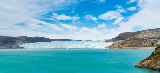 Global Warming and Climate Change . Greenland Glacier front of Eqi glacier in West Greenland AKA Ilulissat and Jakobshavn Glacier. Drains 6.5 percent of the Greenland ice sheet. © Maridav