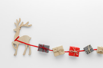 Christmas composition. Reindeer gift top view background with copy space for your text. Flat lay.