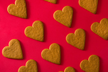 Heart shaped cookies pattern isolated on red background. Valentine's Day and Mother's Day concept.	
