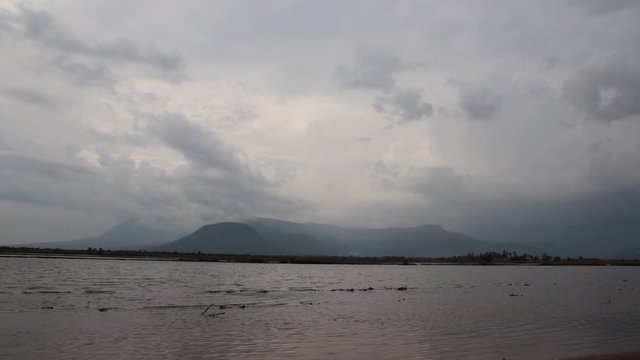 Dark dreamy cinematic scene of the ambient motion of water current in Tomnop Tek Krolar in Kampot Cambodia popularly known as Kampot Secret Lake during the monsoon season