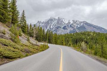 Scenic mountain view with roadway on Bow Valley Parkway in Banff, Canada