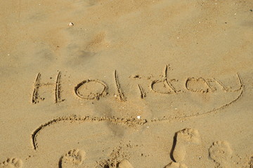 Holiday writing in the sand