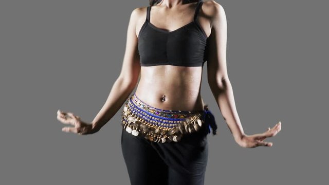 Closeup of anonymous woman dancing zumba in the studio. Shot in 4k resolution