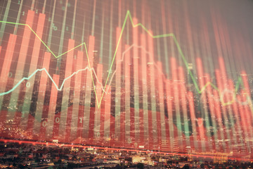 Financial graph on night city scape with tall buildings background double exposure. Analysis concept.
