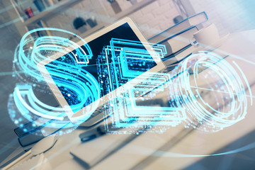 Multi exposure of table with computer and seo drawing hologram. Search optimization concept.