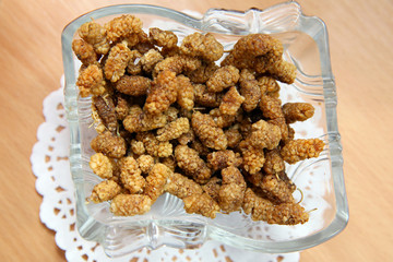 Festive lights of garland. New Year's interior decoration . Christmas wreath handmade on a wooden background, New Year's interior decoration . Christmas wreath handmade on a wooden background.