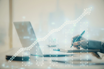 Double exposure of forex chart with man working on computer on background. Concept of market analysis.