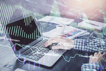 Double exposure of forex chart with man working on computer on background. Concept of market analysis.