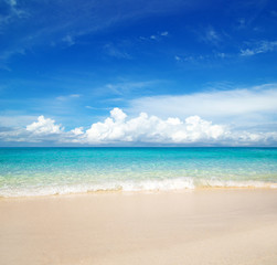 Sea and sky. Perfect blue sea water and blue sky with white fluffy clouds. beautiful beach and tropical sea