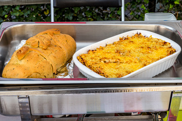 Aztec cake or pastel Azteca, Mexican food and ham bread, Venezuela food on a chafing dish,...