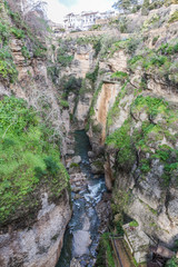 Canyon or Tajo de Ronda, with the Guadalevín River between the rocky slopes in Spain