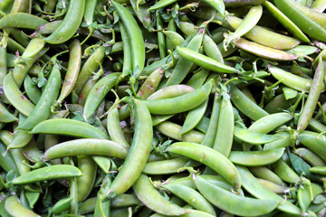 Fresh green peas are sold in the market.